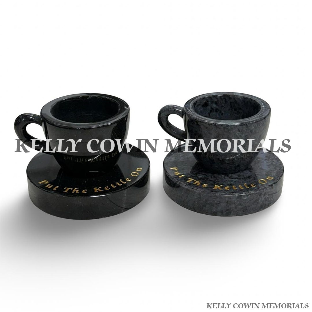 Black and Blue Lagoon granite cup of tea memorials on round plinths by Kelly Cowin Memorials Ireland