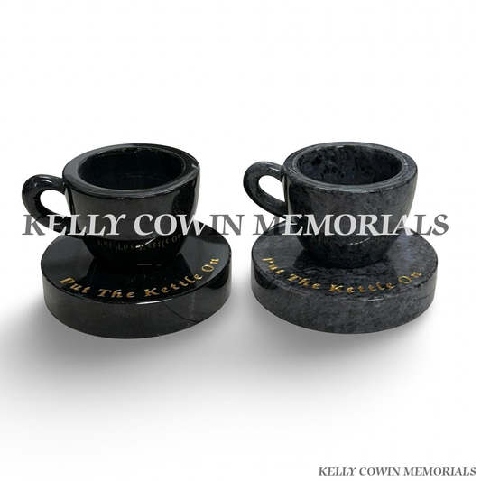 Black and Blue Lagoon granite cup of tea memorials on round plinths by Kelly Cowin Memorials Ireland