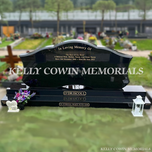 Black granite custom double headstone with gold inscription in Piltown Cemetery County Kilkenny