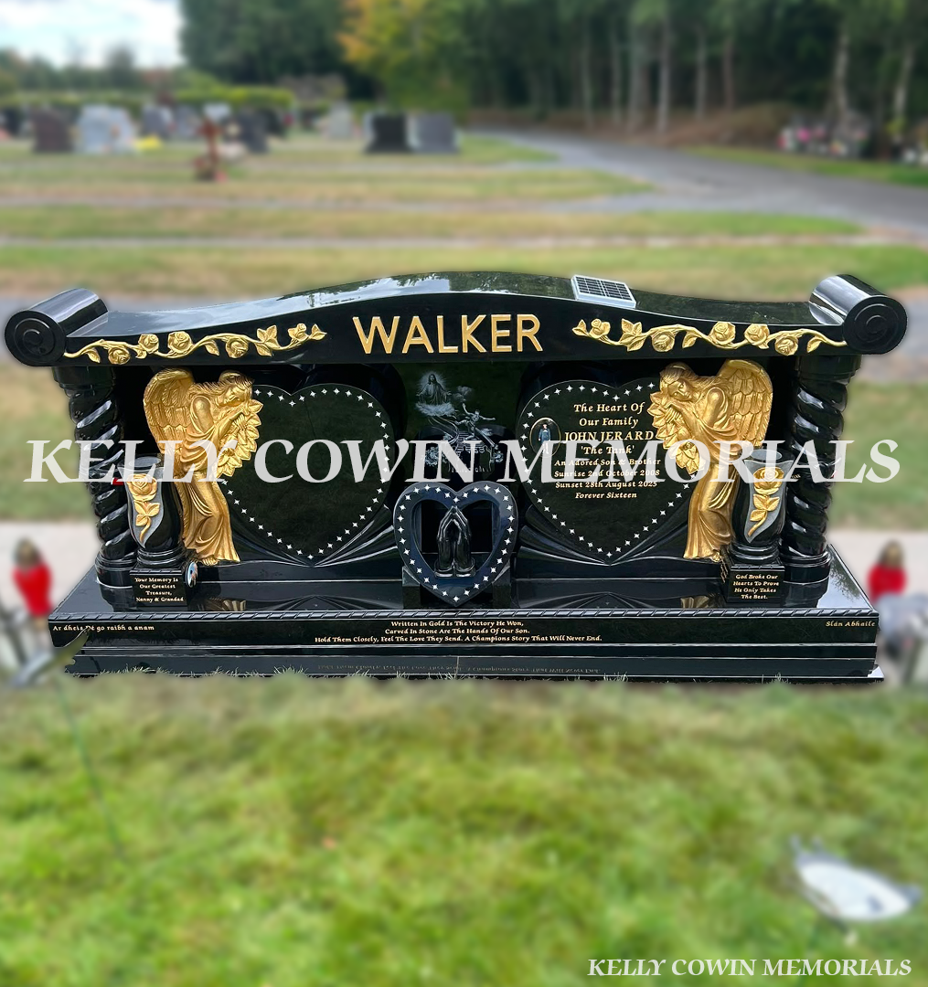 Custom black granite rose carved headstone with gold angels, heart panels and twisted pillars in Newlands Cross Cemetery Dublin.