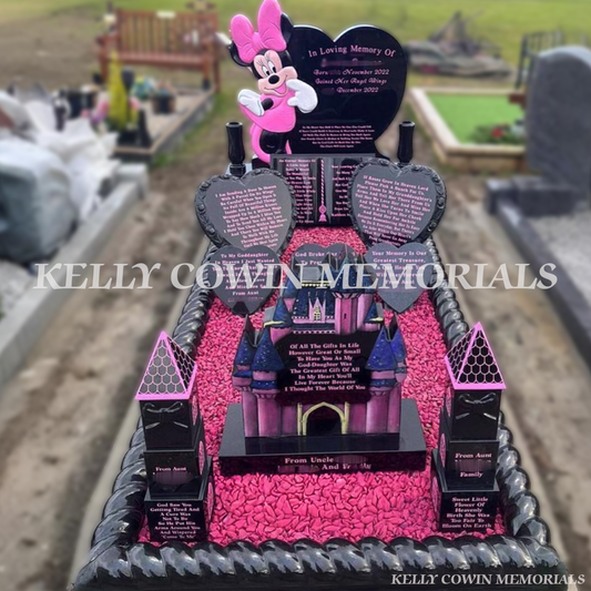 Black granite Minnie Mouse heart children’s headstone with roped kerbing and pink chippings in St. Ibar’s Cemetery Wexford