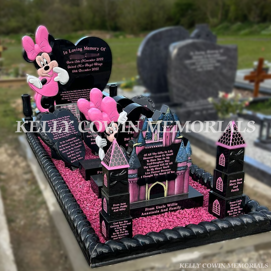 Side view of Black granite Minnie Mouse heart children’s headstone with roped kerbing and pink chippings in St. Ibar’s Cemetery Wexford
