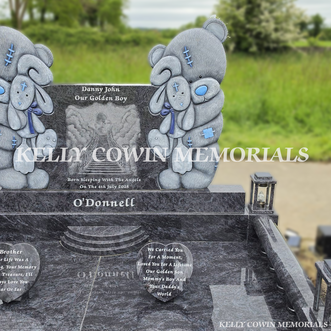 Close up of custom child memorial with teddy bear carvings and laser etched angel image in County Limerick