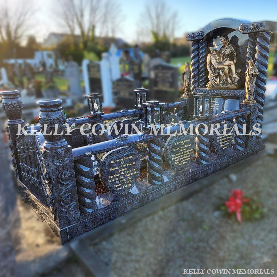Side view of Blue Lagoon kerbed memorial with bronze statues and rail in Wexford Cemetery