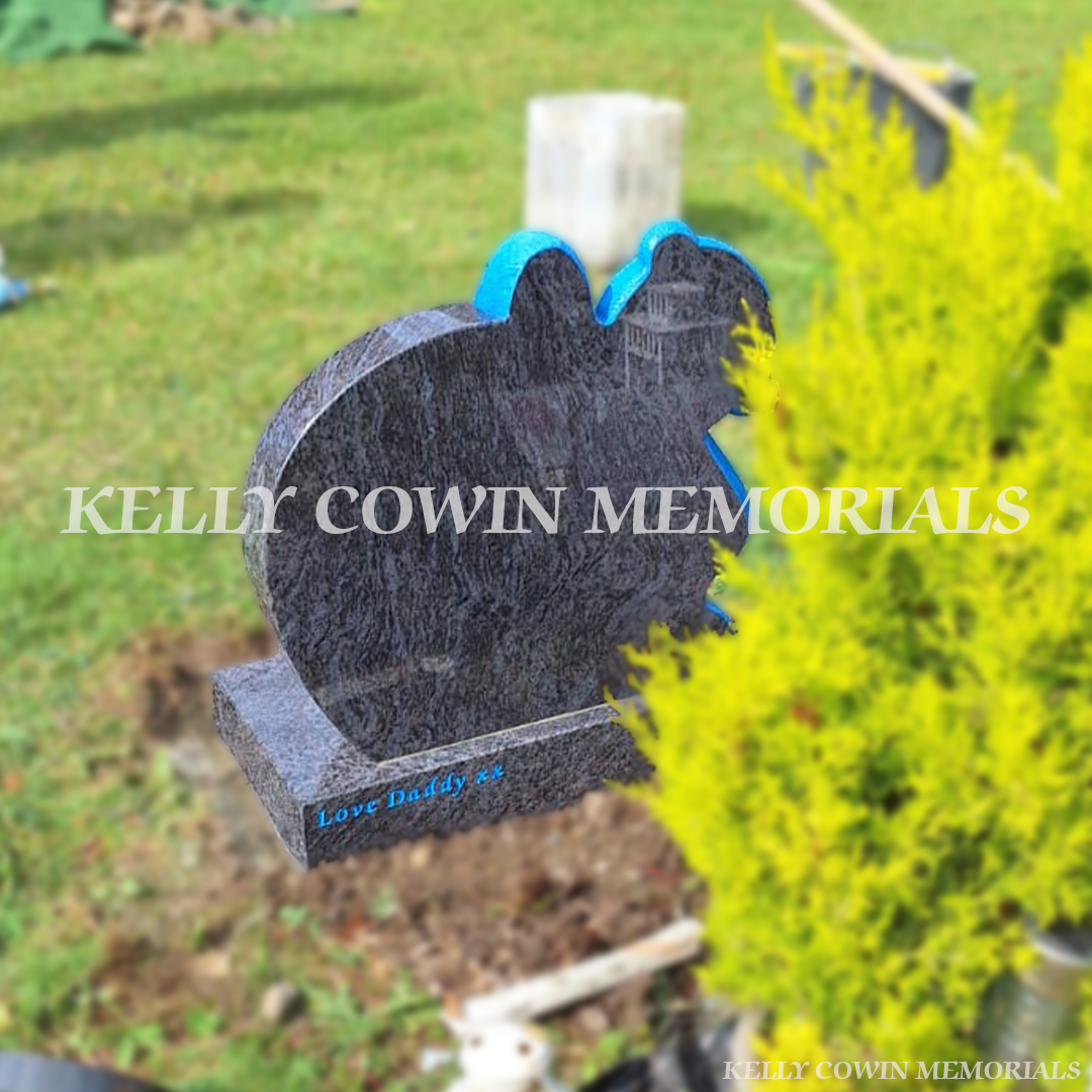 Back view of a Blue Lagoon teddy bear children’s headstone with built-in vase in the Angel Plot section of Glasnevin Cemetery Dublin