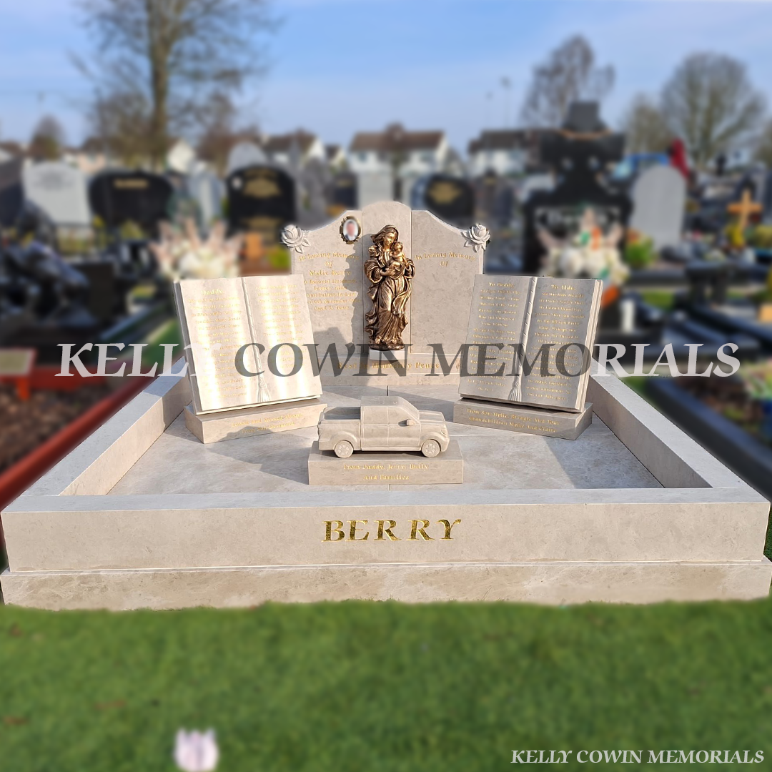 Front view of Haley Beige Cream custom headstone with rose carving and gold leaf inscription in Carlow Cemetery