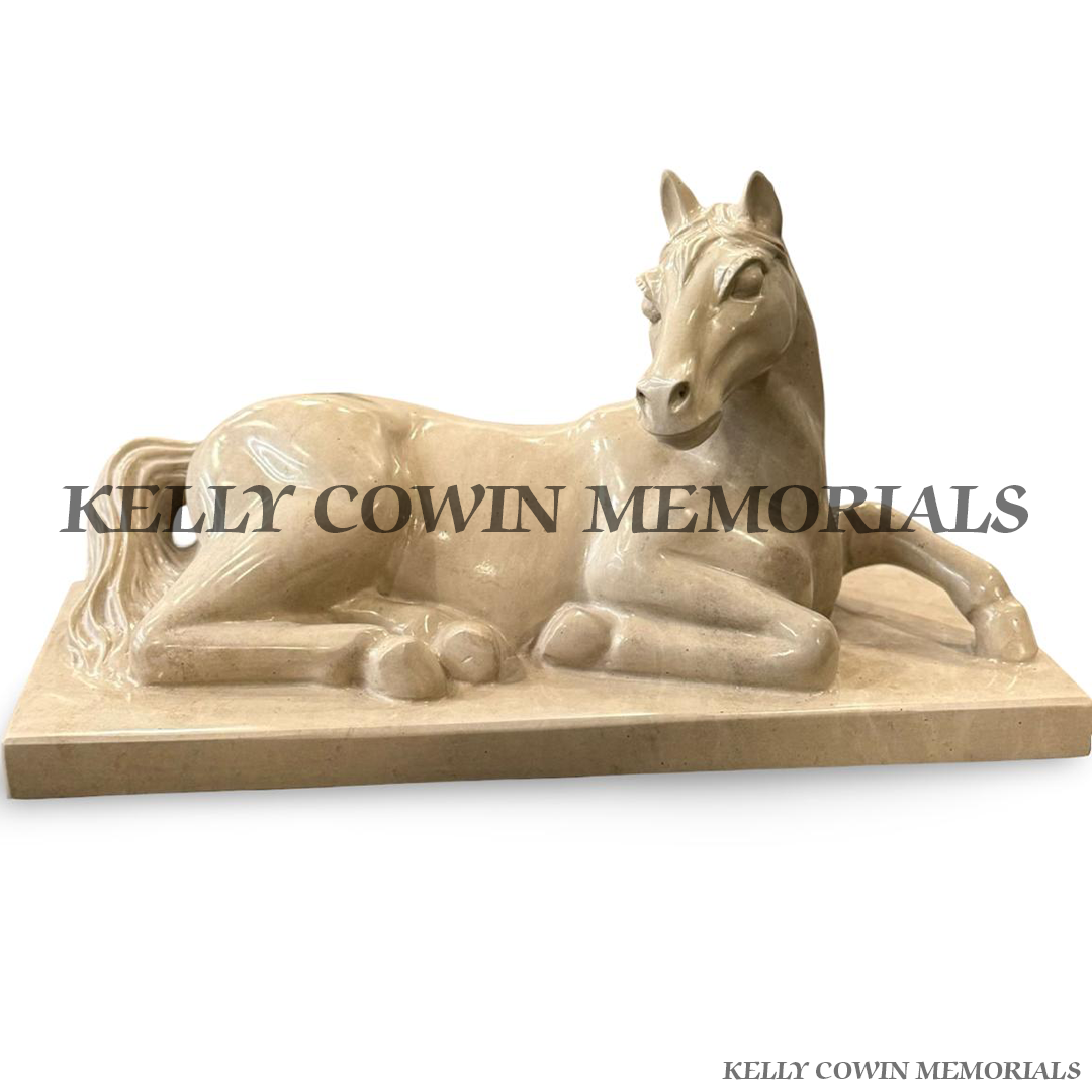 Custom polished Haley Beige granite horse ornament on a matching plinth for a bespoke grave memorial.