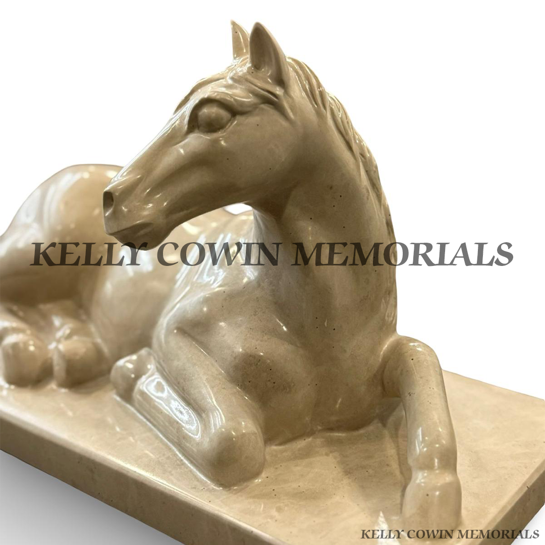 Close-up view of the detailed carved Haley Beige granite horse memorial ornament.