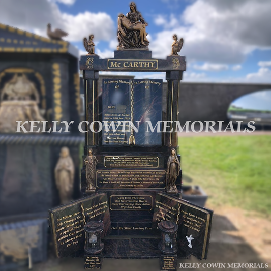 Pandora granite custom book headstone with cap and bronze statues in Dublin Cemetery
