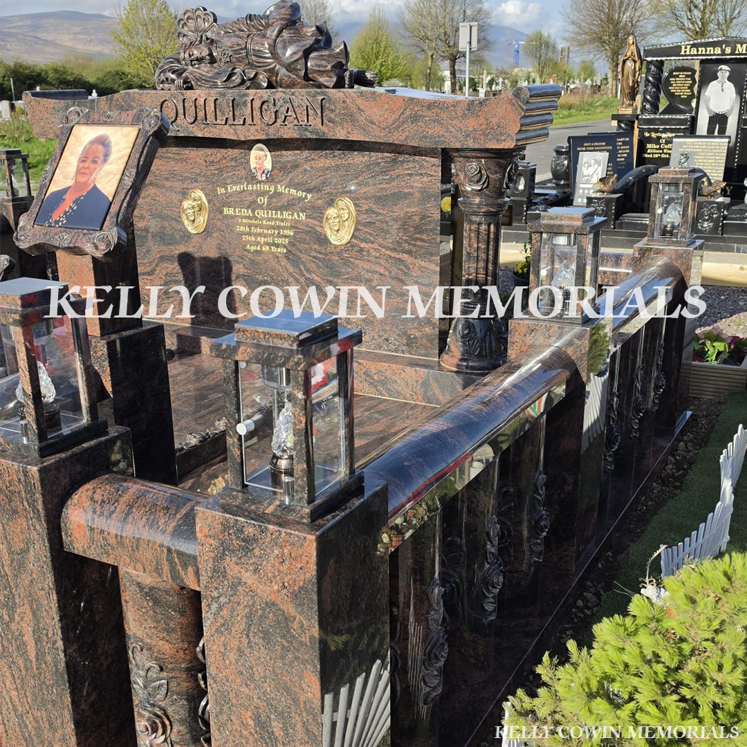 Close-up of carved roses and 23.5ct gold leaf lettering on Pandora granite headstone