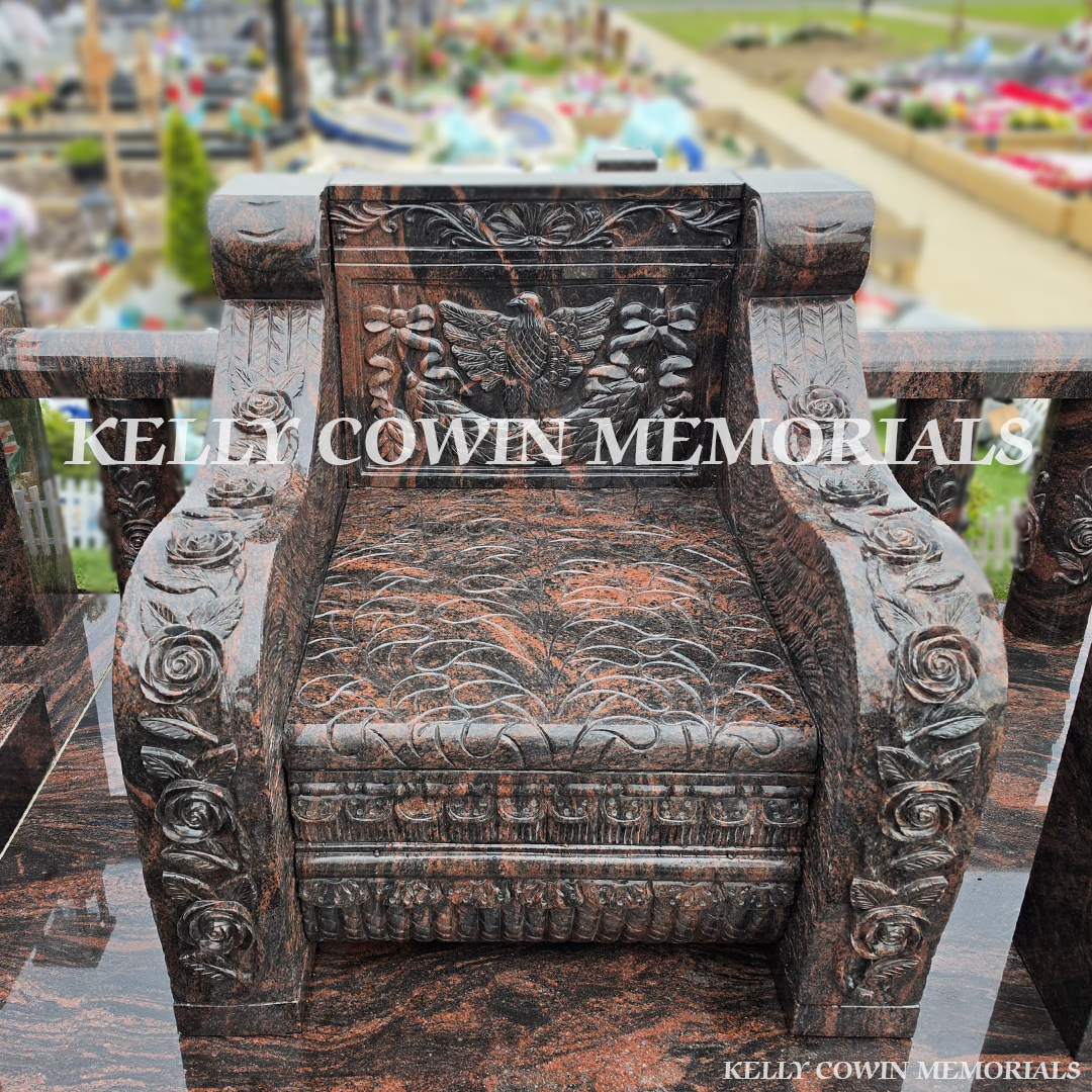 Font view of Pandora granite memorial with railings, pillars and statues