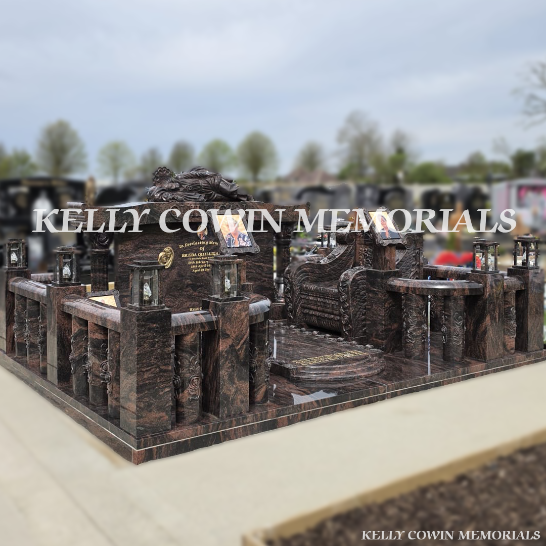 Side view of Pandora granite memorial with railings, pillars and statues