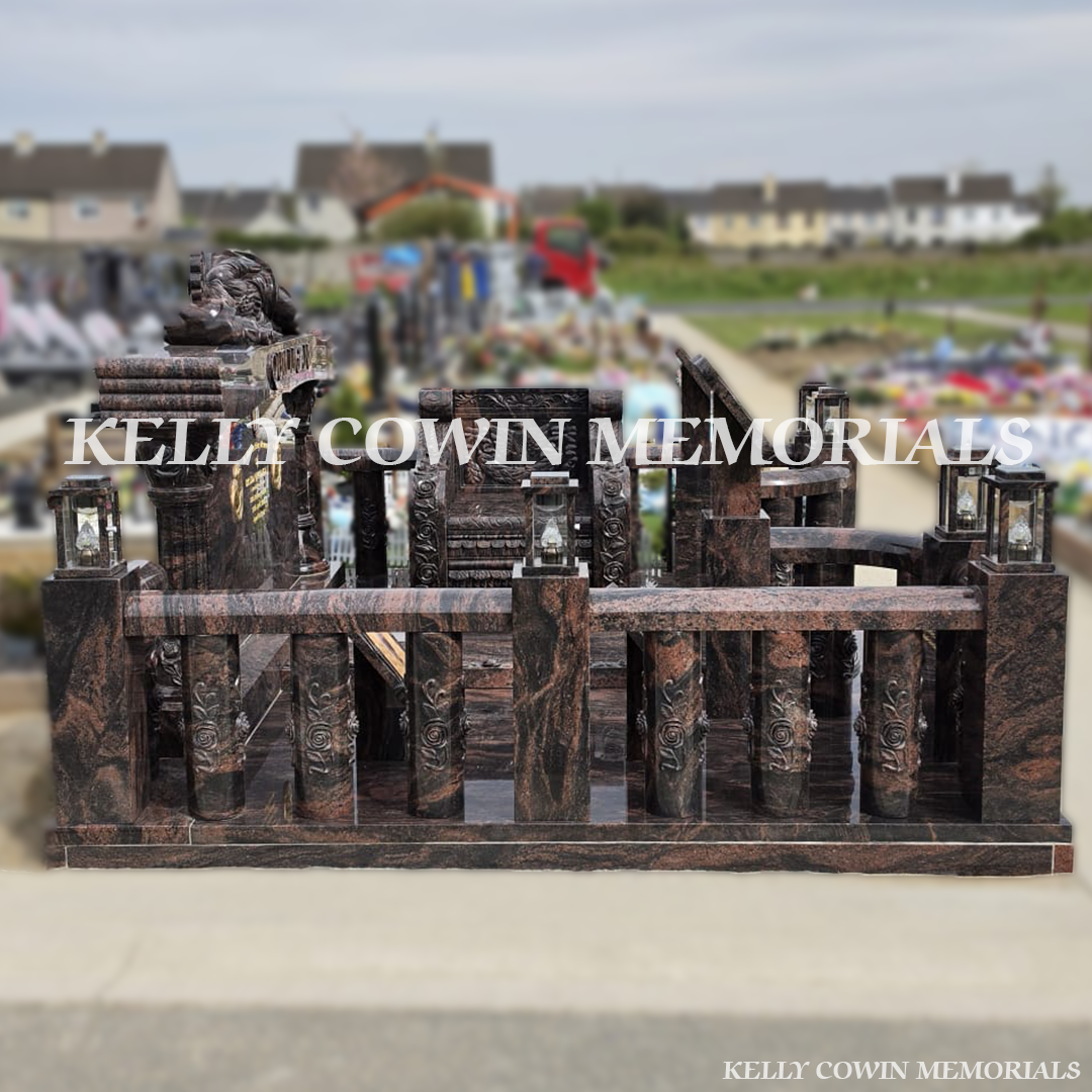 Side view of Pandora granite memorial with railings, pillars and statues