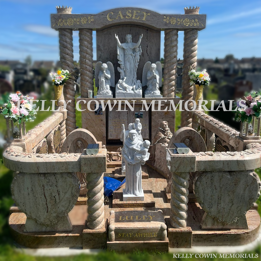Custom Traveller headstone with twisted pillars, religious statues and rose-carved railings in Mount St. Oliver’s Cemetery Limerick