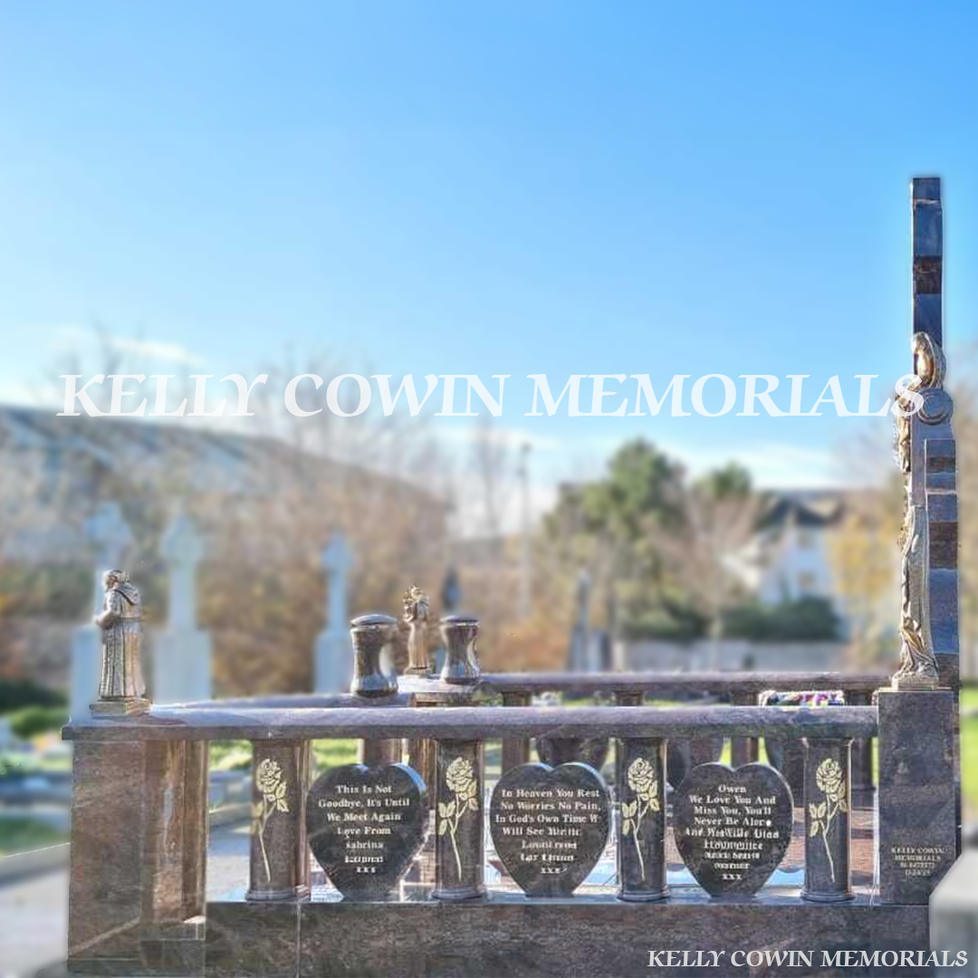 Side view showing granite rail surround, steps, bronze statues and lanterns in Glasnevin Cemetery Dublin