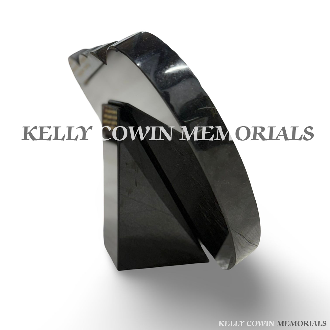 Front view of black granite double heart plaque with gold inscription and engraved images