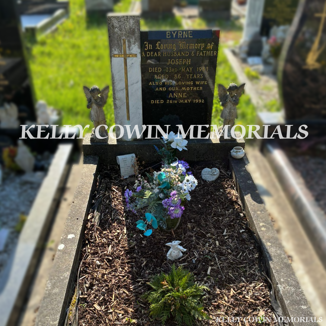 Before renovation of black granite and limestone memorial in Esker Cemetery