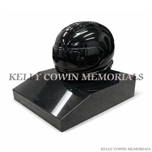 Black granite motorbike helmet grave accessory on base by Kelly Cowin Memorials Ireland