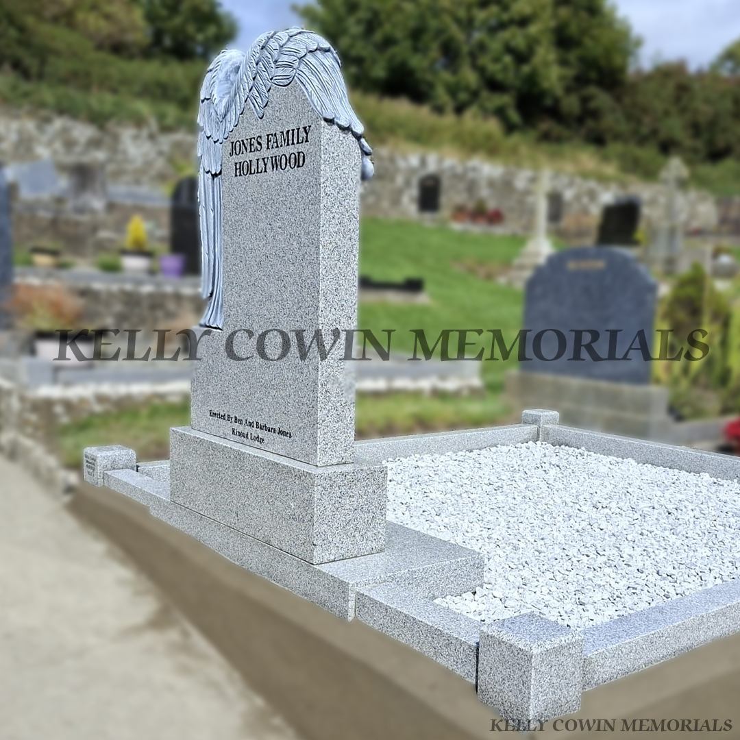 Back view of a Grey granite angel headstone with kerbing and chippings installed at Hollywood Cemetery Dublin by Kelly Cowin Memorials