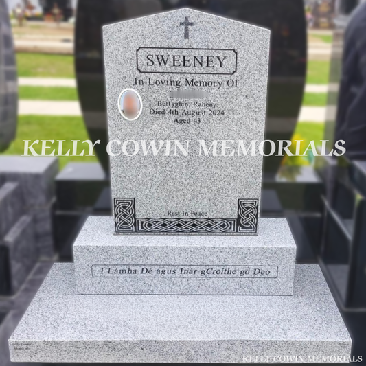 Front view of grey granite apex headstone with black inscription and oval ceramic photograph in Dardistown Cemetery Dublin