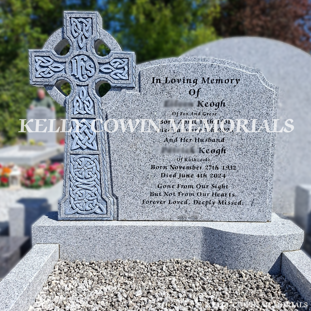 Close-up of Celtic Cross carving and black engraved inscription