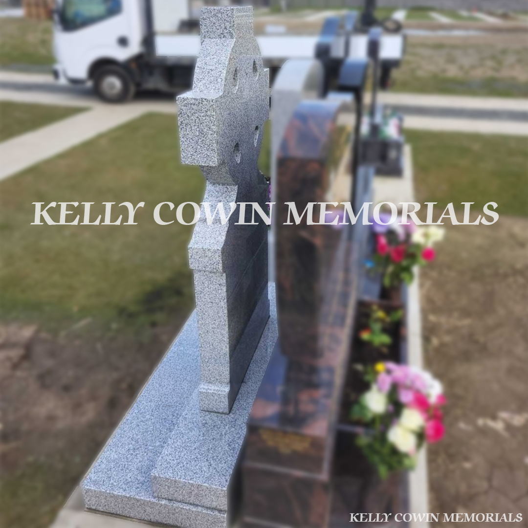 Side view of Grey Granite Celtic Cross headstone showing carved cross detail and plinth in Balgriffin Cemetery