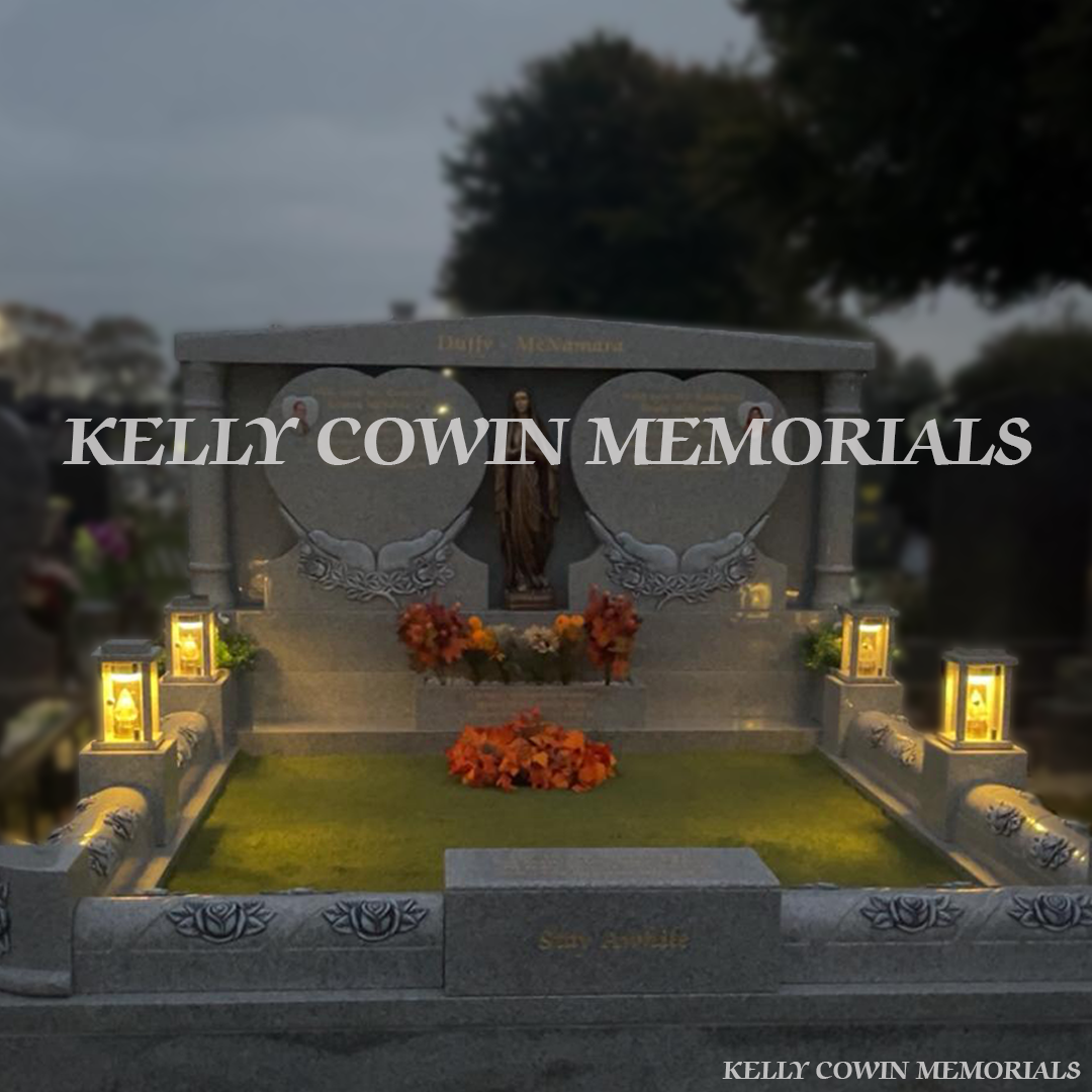 Grey granite double heart Traveller headstone with bronze Our Lady statue, rose carved kerbing and gold leaf inscription in Mount St Oliver Cemetery, Limerick