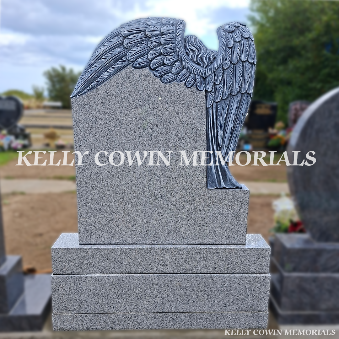 back view of a Grey granite angel baby headstone with carved guardian angel, heart detail, two large vases, base and plinth installed in Flemington Cemetery by Kelly Cowin Memorials.