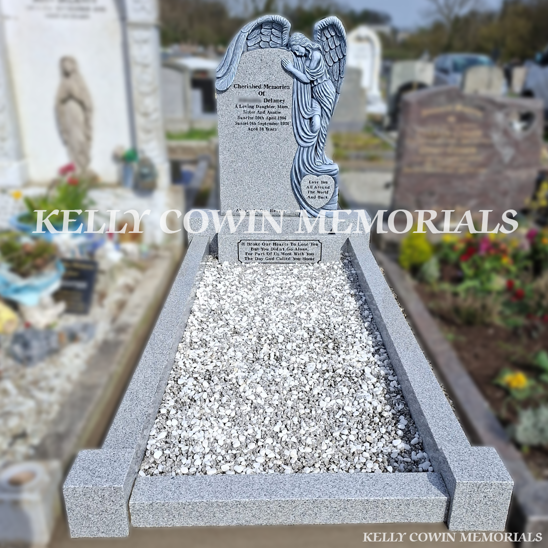 Front view of grey granite angel headstone with black inscription in Fingal Cemetery