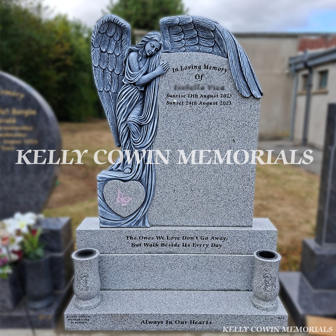 Grey granite angel baby headstone with carved guardian angel, heart detail, two large vases, base and plinth installed in Flemington Cemetery by Kelly Cowin Memorials.