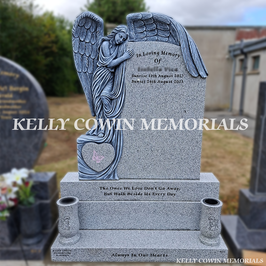 Grey granite angel baby headstone with carved guardian angel, heart detail, two large vases, base and plinth installed in Flemington Cemetery by Kelly Cowin Memorials.