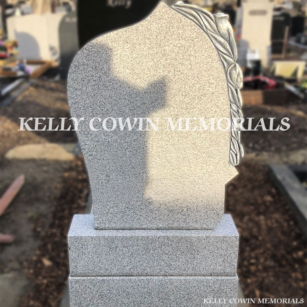 Back view of Antique Rose Grey Granite headstone highlighting craftsmanship by Kelly Cowin Memorials