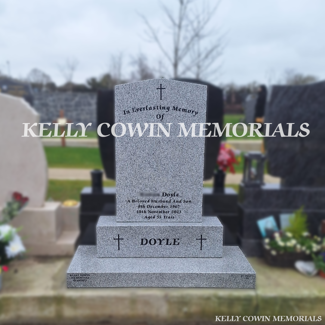 Front view of grey granite Apex headstone with black inscription in Balgriffin Cemetery