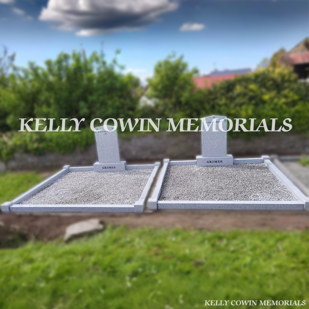 Front view of matching grey granite Apex headstones in Holmpatrick Cemetery