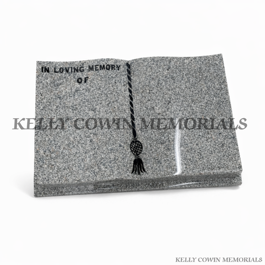 Memorial stone with 'In Loving Memory of' text and a decorative element, branded with 'Kelly Cowin Memorials'.