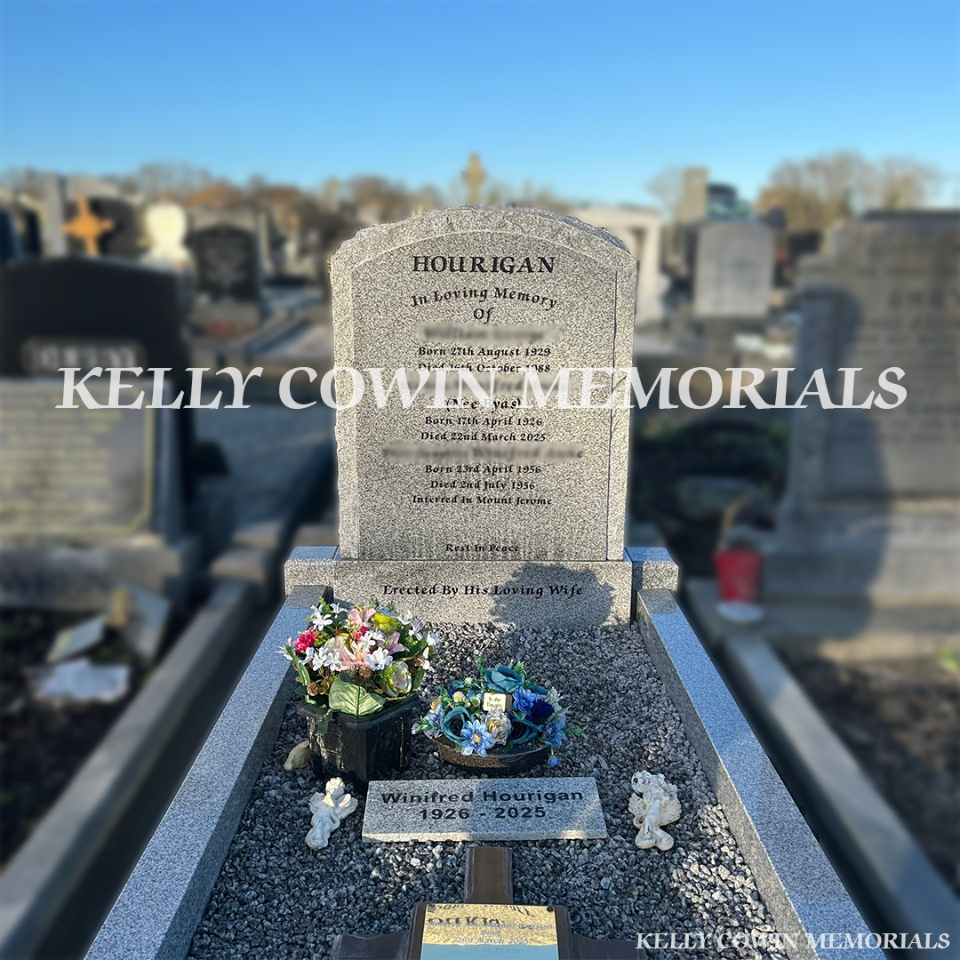 Front close up view of grey granite rough edge boulder headstone with kerbing and chippings in Fingal Cemetery Dublin by Kelly Cowin Memorials