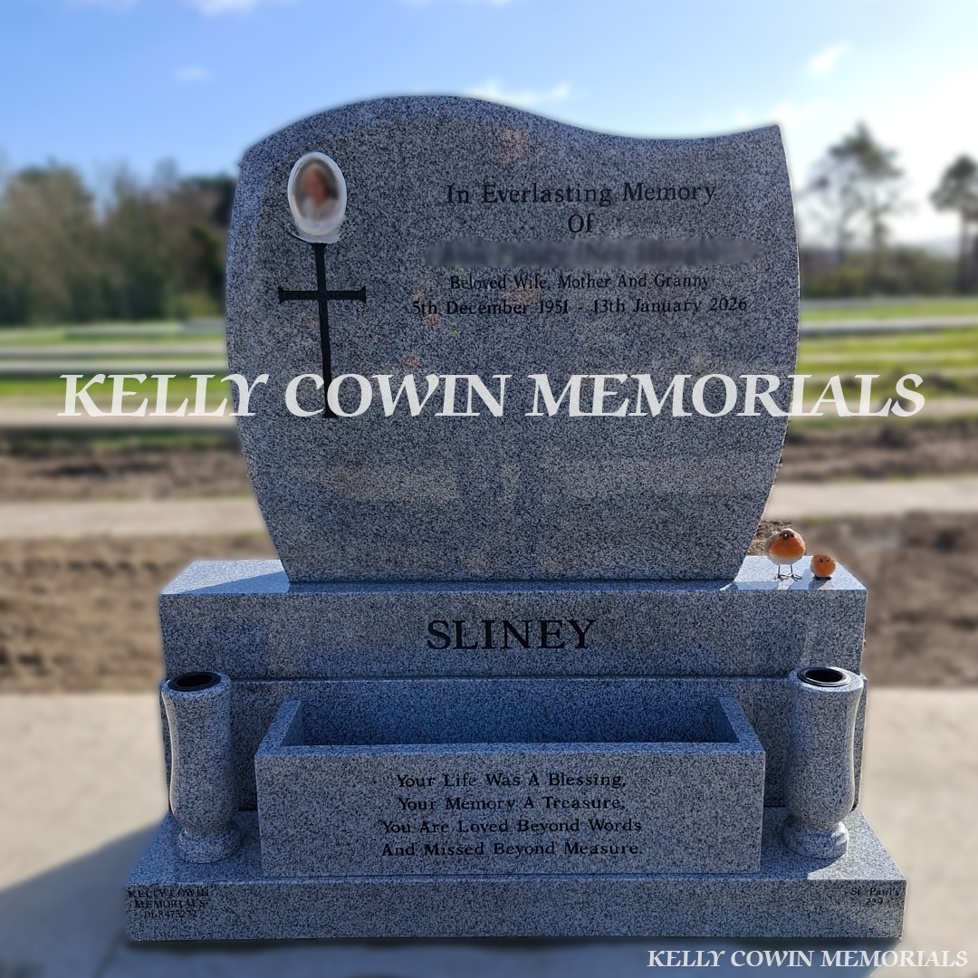 Front view of grey granite C1 headstone with black inscription in Balgriffin Cemetery