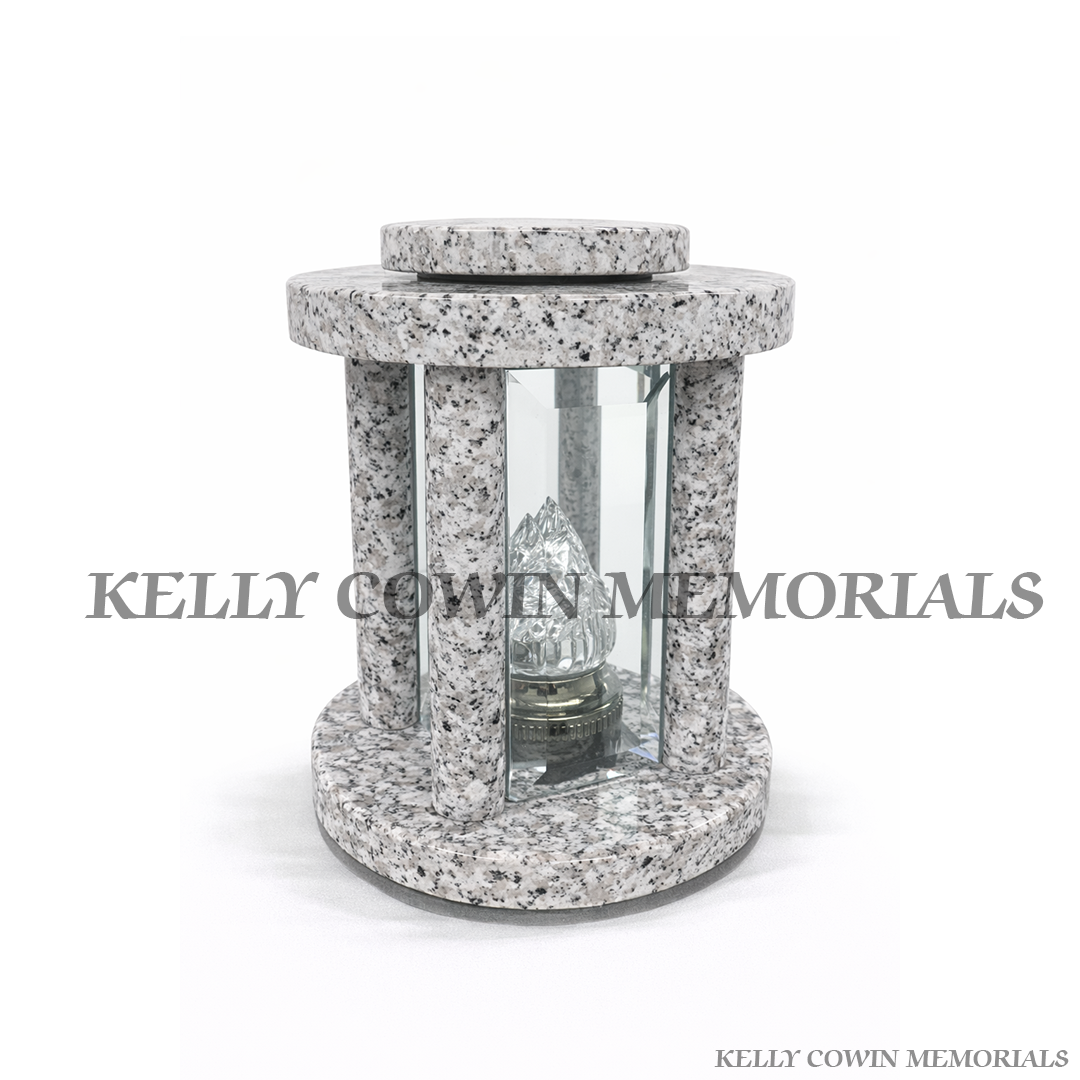 Grey granite circle shaped memorial lantern with flame insert grave tribute light Ireland