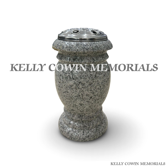 Front view of grey granite urn shaped vase with silver lid