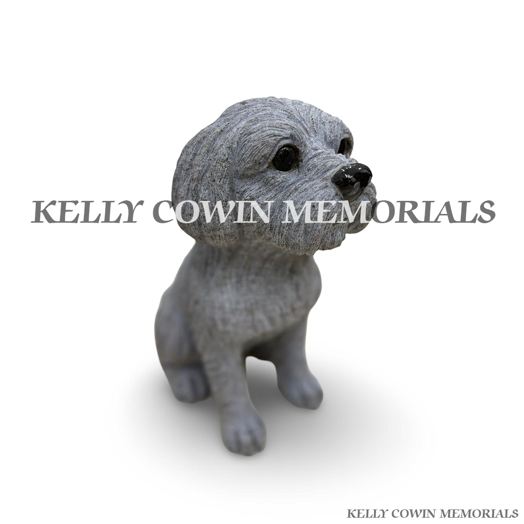 Side view of rough grey granite dog memorial ornament