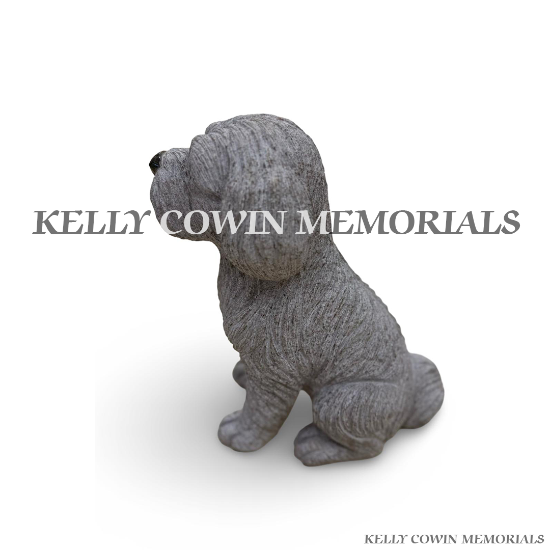 Close-up of polished black granite detailing on grey granite dog memorial