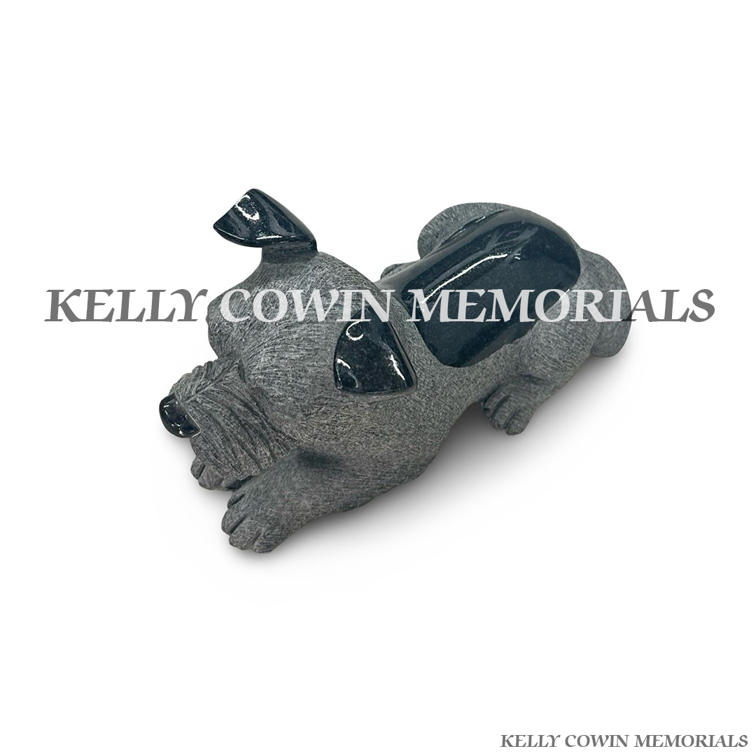 Close-up of polished black granite detailing on grey granite dog memorial