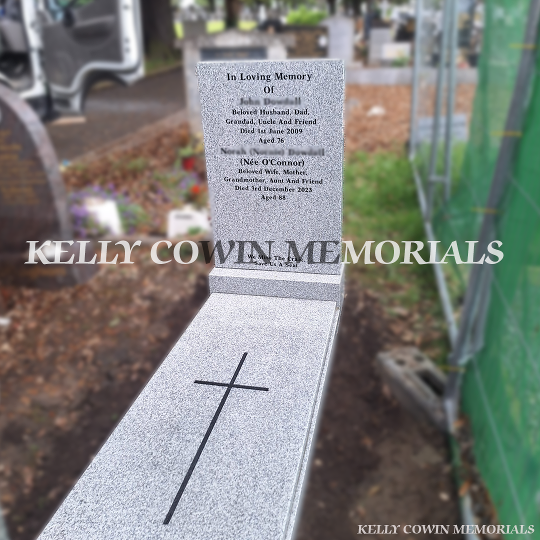 Grey granite rectangular headstone with matching base, kerb surround and full cover slab featuring engraved cross detail, installed in Glasnevin Cemetery Dublin by Kelly Cowin Memorials.