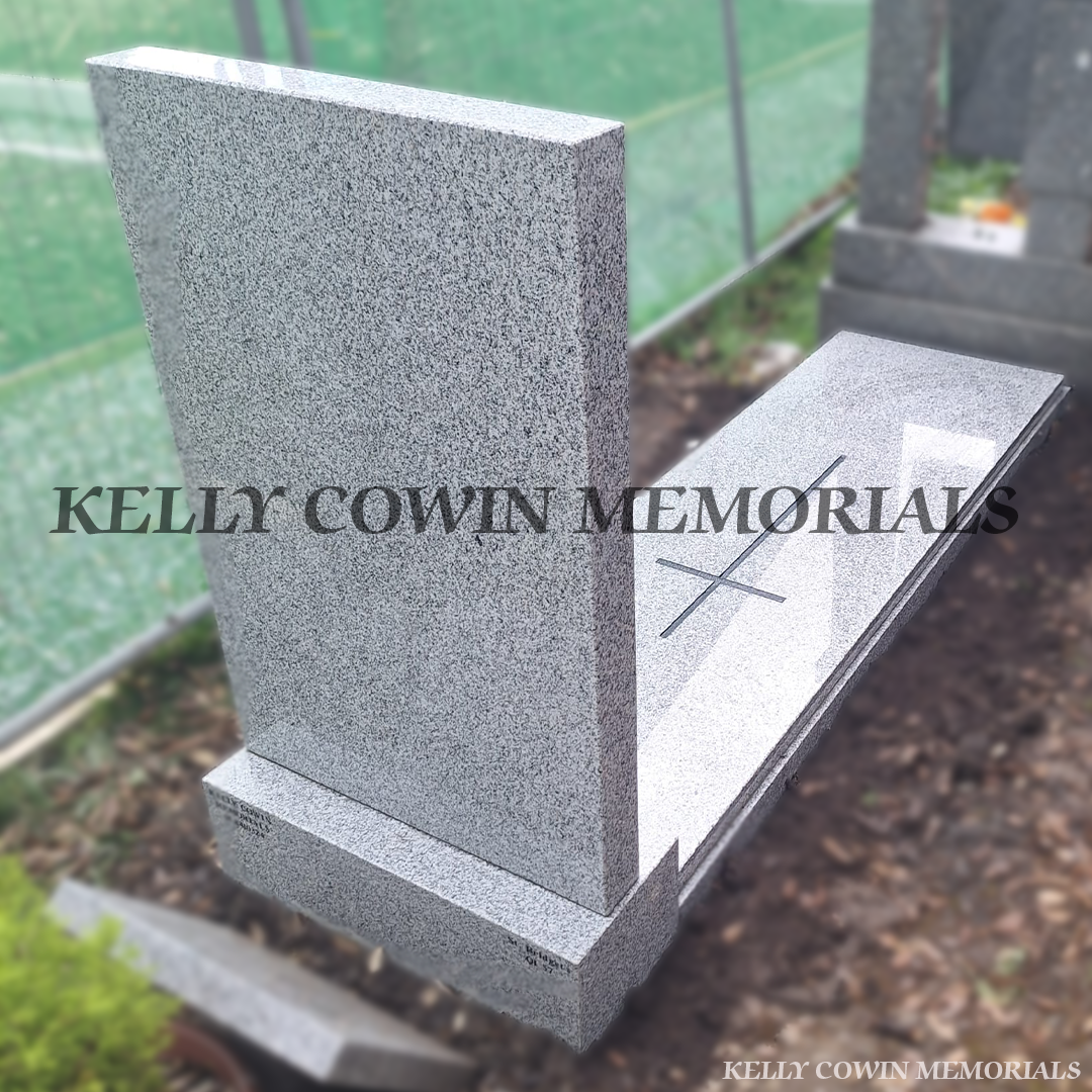 /back view of Grey granite rectangular headstone with base, kerb surround and full cover slab featuring engraved cross detail, installed in Glasnevin Cemetery Dublin by Kelly Cowin Memorials.