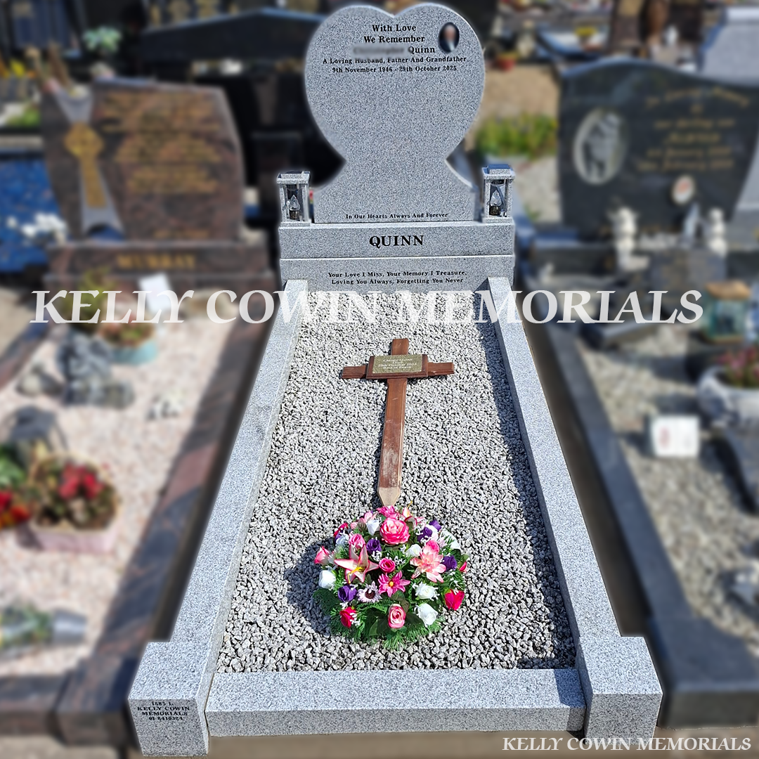Front view of grey granite heart headstone with black inscription in St. Peter and Paul’s Cemetery