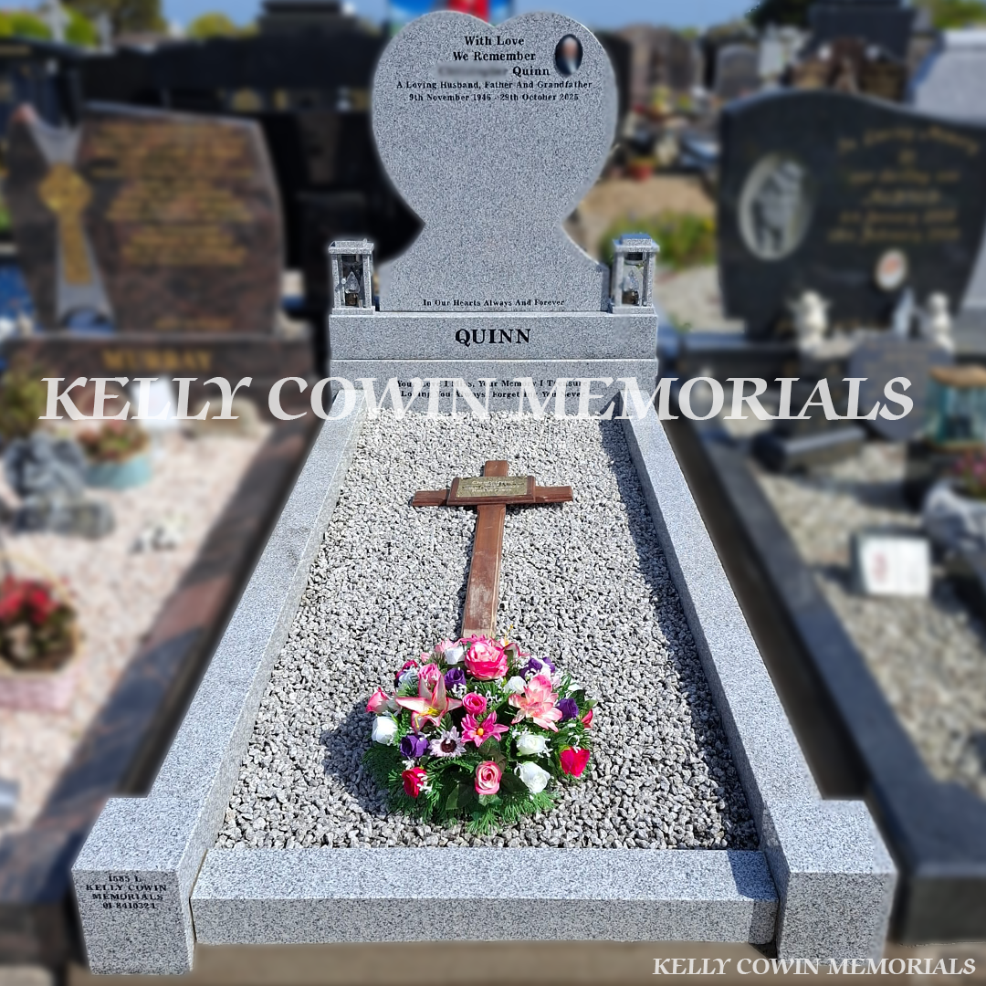 Front view of grey granite heart headstone with black inscription in St. Peter and Paul’s Cemetery