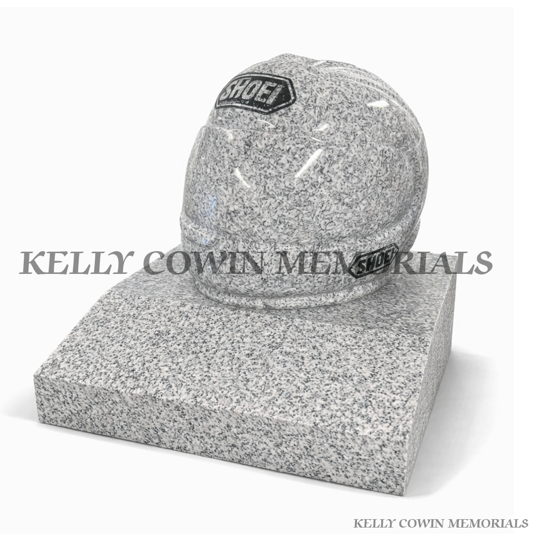 Grey granite motorcycle helmet grave accessory with polished finish on granite base by Kelly Cowin Memorials Ireland
