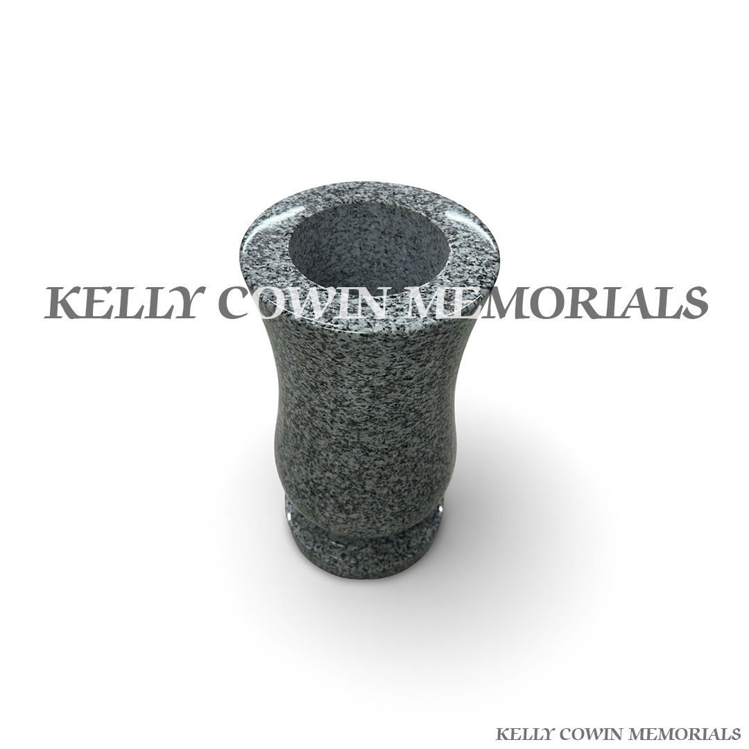 Close-up of grey granite texture and polished finish on tall vase