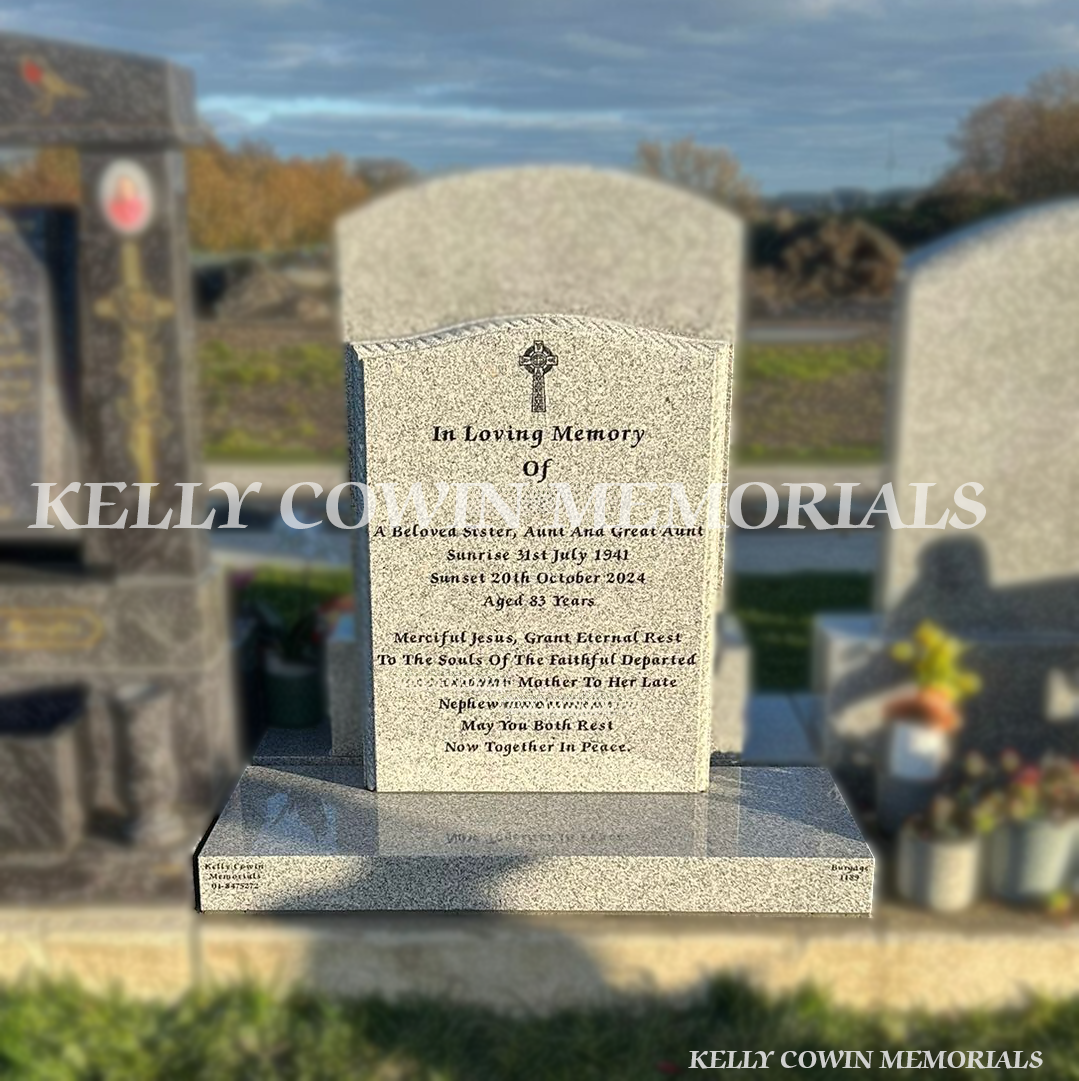 Grey granite OG headstone with rope-edged base, engraved Celtic Cross, and black inscription installed in Balgriffin Cemetery, Dublin.
