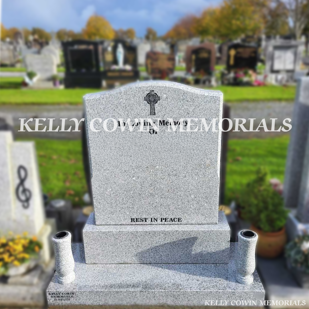 Front view of grey granite OG headstone with black inscription and matching granite vases in Dardistown Cemetery Dublin
